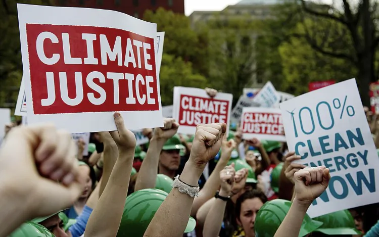 In this file photo, demonstrators outside the White House chant during a rally to protest British Petroleum (BP) and the U.S. Chamber of Commerce in Washington, D.C. following the Deepwater Horizon oil spill. BP recently reached a record $4 billion settlement with the Justice Dept. over the Gulf oil disaster of 2010. (Jim Watson/AFP/Getty Images)