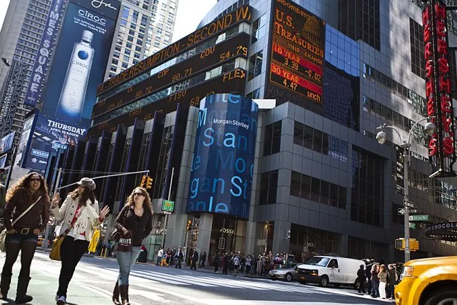 Pedestrians cross the street by the Morgan Stanley building in Times Square April 21, 2011 in New York City. (Ramin Talaie/Getty Images)