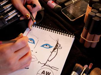 Detail of a makeup plan at a spring fashion show. If you are putting a pop of color on your eyes, wearing an equally bright lipstick may be too much, but balance is key. (Lisa Maree Williams/Getty Images)