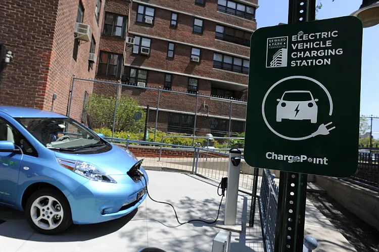 A Nissan Leaf electric vehicle (EV) is plugged into a charging station at the Seward Park Co-op apartments on Manhattan’s Lower East Side, May 2011. (Stan Honda/AFP/file/Getty Images)