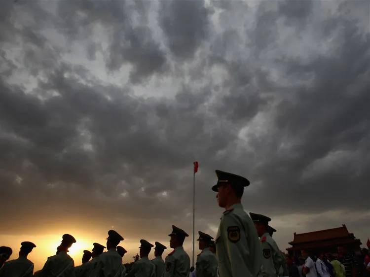 Paramilitary policemen patrol at Tiananmen Square outside the Forbidden City. (Feng Li/Getty Images)