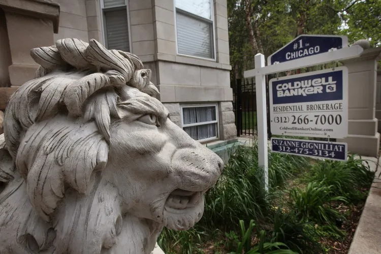 A real estate sign stands in front of a building on May 31, 2011, in Chicago, Ill., in this file photo. According to Freddie Mac data, a 30-year fixed rate mortgage on average was 3.87 percent, the lowest since records were kept in the 1950s. (Photo by Scott Olson/Getty Images)