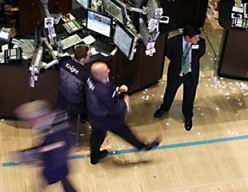 MARKETS SOARING: Traders work on the floor of the New York Stock Exchange on June 23 in this file photo. (Spencer Platt/Getty Images)