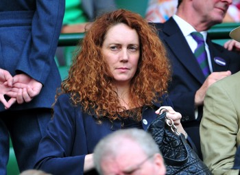 RESIGNED: Chief executive of News International Rebekah Brooks is seen attending the Wimbledon Tennis Championships earlier this month in London. Brooks has resigned from her post at the News Corp. subsidiary.