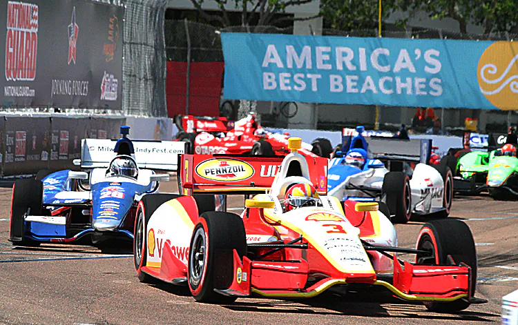 Helio Castroneves speeds through the streets of St. Petersburg. IndyCar will be bringing its intense street-racing action to Houston starting in 2013. (James Fish/The Epoch Times)