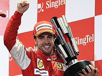 TWO IN A ROW: Fernando Alonso celebrates after winning the Formula 1 Singapore Grand Prix, his second F1 Grand Prix win in as many races. (Mark Thompson/Getty Images) TWO IN A ROW: Fernando Alonso celebrates after winning the Formula 1 Singapore Grand Prix, his second F1 Grand Prix win in as many races. (Mark Thompson/Getty Images)