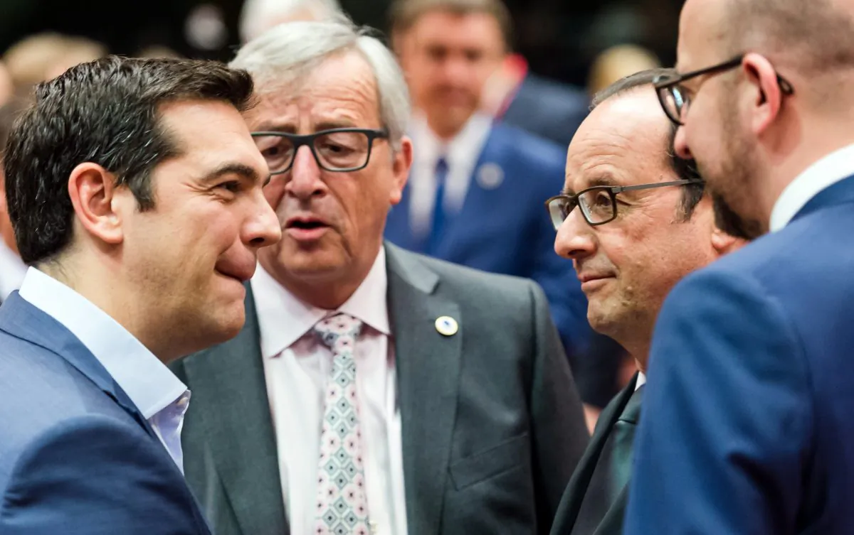 (L-R) Greek Prime Minister Alexis Tsipras, European Commission President Jean-Claude Juncker, French President Francois Hollande, and Belgian Prime Minister Charles Michel at a meeting of eurozone heads of state at the EU Council building in Brussels on July 12, 2015. (AP Photo/Geert Vanden Wijngaert)