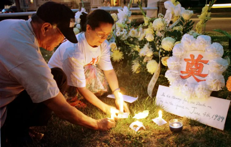 Demonstrators light up candles during a candlelight vigil outside the Chinese Embassy in Washington, D.C. on Thursday, June 4, 1999 to mark the 10th anniversary of the June 4 Tiananmen Square crackdown. (Alex Wong/Getty Images)