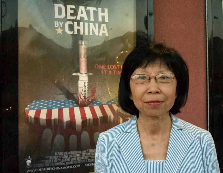 Peter Navarro (L) director of “Death by China,” with Jane Xenos and John Simmons, both independent business owners who were impressed with the show and its balanced message. (Robin Kemker/The Epoch Times)