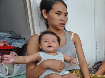 Former refugees and their children from Myanmar who had settled in Malaysia chat in their house in Kuala Lumpur on August 31, 2011. (Mohd Rasfan/AFP/Getty Images)