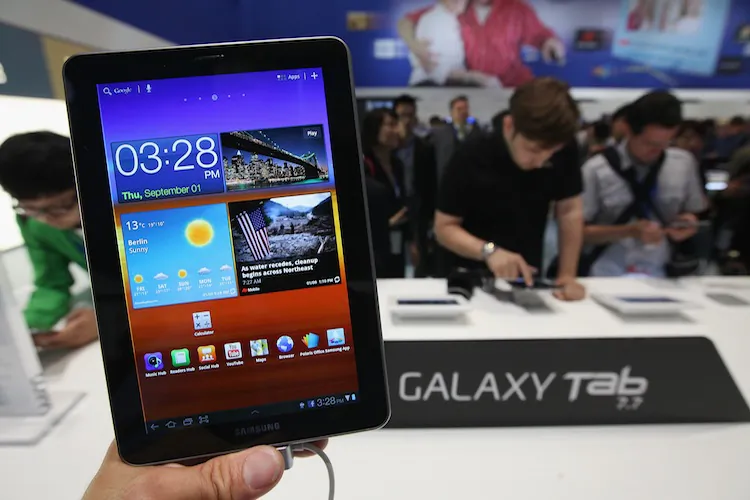Visitors try out a Samsung Galaxy Tab 7.7 tablet at the Samsung hall at the IFA 2011 consumer electronics and appliances trade fair the day before the fair's official opening on September 1, 2011 in Berlin, Germany. (Sean Gallup/Getty Images)