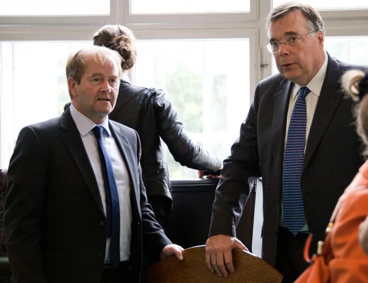 Iceland's former Prime Minister Geir Haarde (R) and his lawyer Andri Arnason (L), are seen on Sept. 5, 2011, at the Icelandic Culture House in Reykjavik during Haarde's trial for allegedly contributing to the country's economic collapse. (Halldor Kolbeins/AFP/Getty Images)
