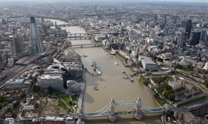 An aerial view of the Thames River in London from the air with the Shard and Tower Bridge in the foreground, in London, on Sept. 5, 2011. (Tom Shaw/Getty Images)
