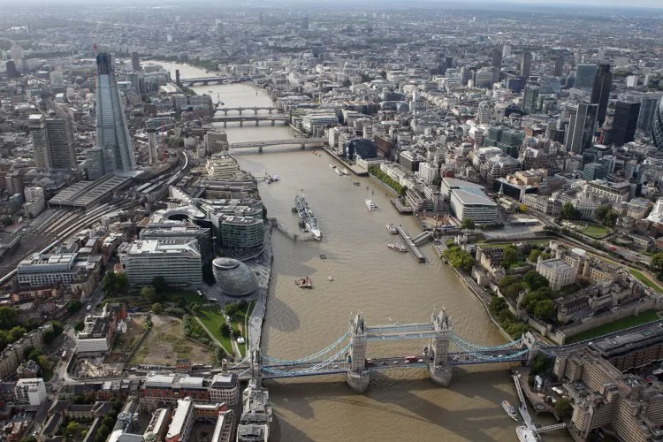 An aerial view of the Thames River in London from the air with the Shard and Tower Bridge in the foreground, in London, on Sept. 5, 2011. (Tom Shaw/Getty Images)