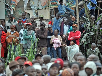 Residents of a shantee in Nairobi react to an oil pipeline explosion on September 12, 2011. (Tony Karumba/AFP/Getty Images)