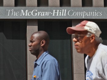 Pedestrians walk by the McGraw-Hill headquarters on September 12, 2011 in New York City. (Justin Sullivan/Getty Images)