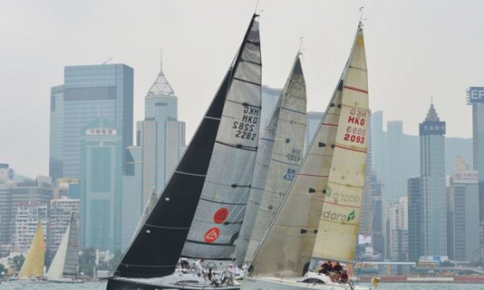 ‘FreeFire’ (left) and ‘Jelik 5’ duel on their way out of Hong Kong’s Victoria Harbour after the start of the Hong Kong to Hainan race last week. (Bill Cox/The Epoch Times)