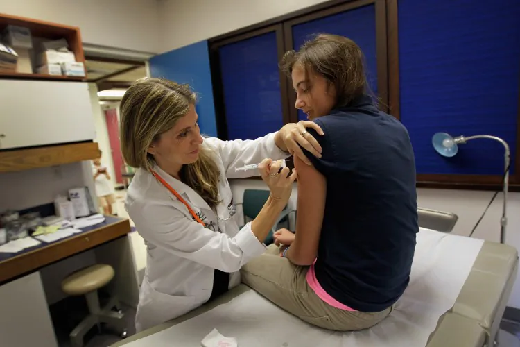 A pediatrician gives an HPV vaccination to a 13-year-old girl in her office at the Miller School of Medicine on Sept. 21, 2011, in Miami, Florida. According to some medical professionals, at least 45 tests and procedures routinely performed on patients across a range of fields are often unnecessary and may in fact be harmful. (Joe Raedle/Getty Images)
