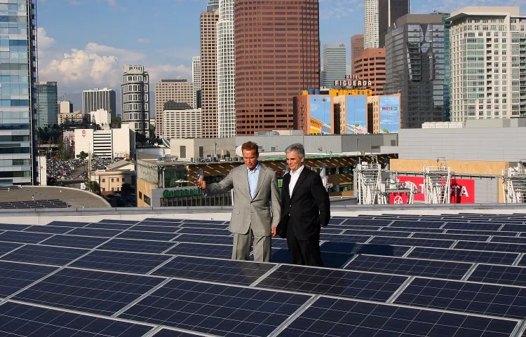 Former governor Arnold Schwarzenegger and Austrian Chancellor Werner Faymann tour Staples Center PV roof during the Solar Energy Research Labs Tour on September 23, 2011 in Los Angeles, California. (Maury Phillips/Getty Images For Mercury LLC)