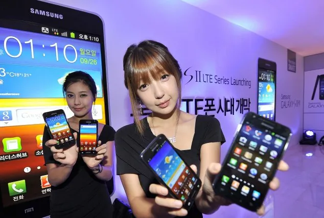 South Korean models display Samsung Electronics' new Galaxy smartphones compatible with long-term evolution (LTE) technology at its main building in Seoul on Sept. 26. (Jung Yeon-Je/AFP/Getty Images)