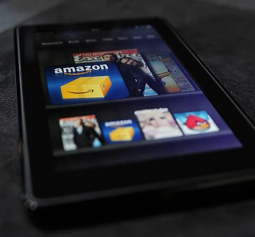 The Amazon Kindle Fire tablet is displayed at a press conference in New York on Sept. 28, 2011. Some publishing companies may have to rearrange their approach to selling books in today’s market.(EMMANUEL DUNAND/AFP/Getty Images)