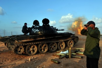 A Libyan National Transitional Council (NTC) tank shells positions of Moammar Gadhafi loyalists from an outpost on the west side of Sirte on September 29, 2011. (Aris Messinis/AFP/Getty Images)