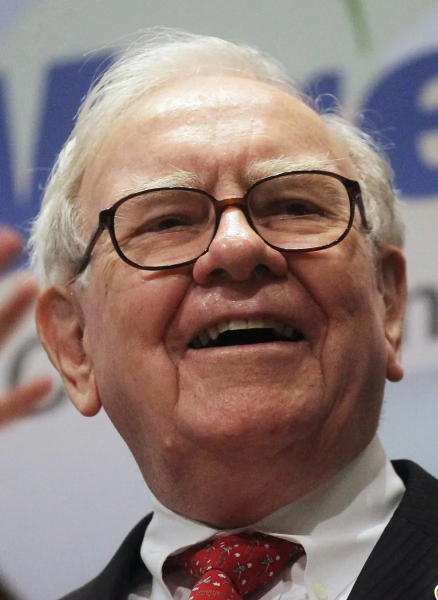 Berkshire Hathaway Inc. Chairman and CEO Warren Buffett smiles at the New York Stock Exchange before ringing the opening bell, Sept. 30. Buffett announced Monday that his company has made a $10.7 billion investment in IBM. (Mario Tama/Getty Images)