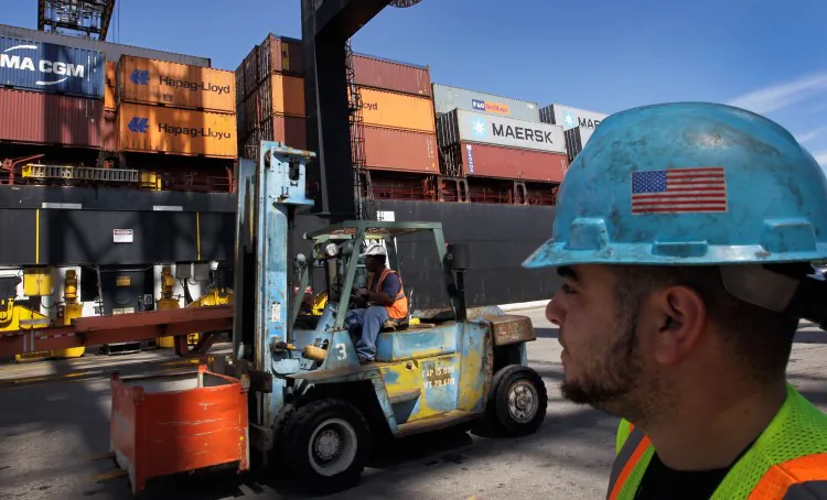 Longshoremen work next to a container ship at Port Everglades in Fort Lauderdale, Oct. 2011. (Joe Raedle/Getty Images)
