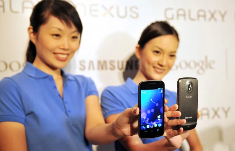 Models hold the new Samsung Galaxy Nexus Android phone during its official launch in Hong Kong on Oct. 19, 2011. Samsung has become the world's No. 1 smartphone maker. (LAURENT FIEVET/Getty Images)