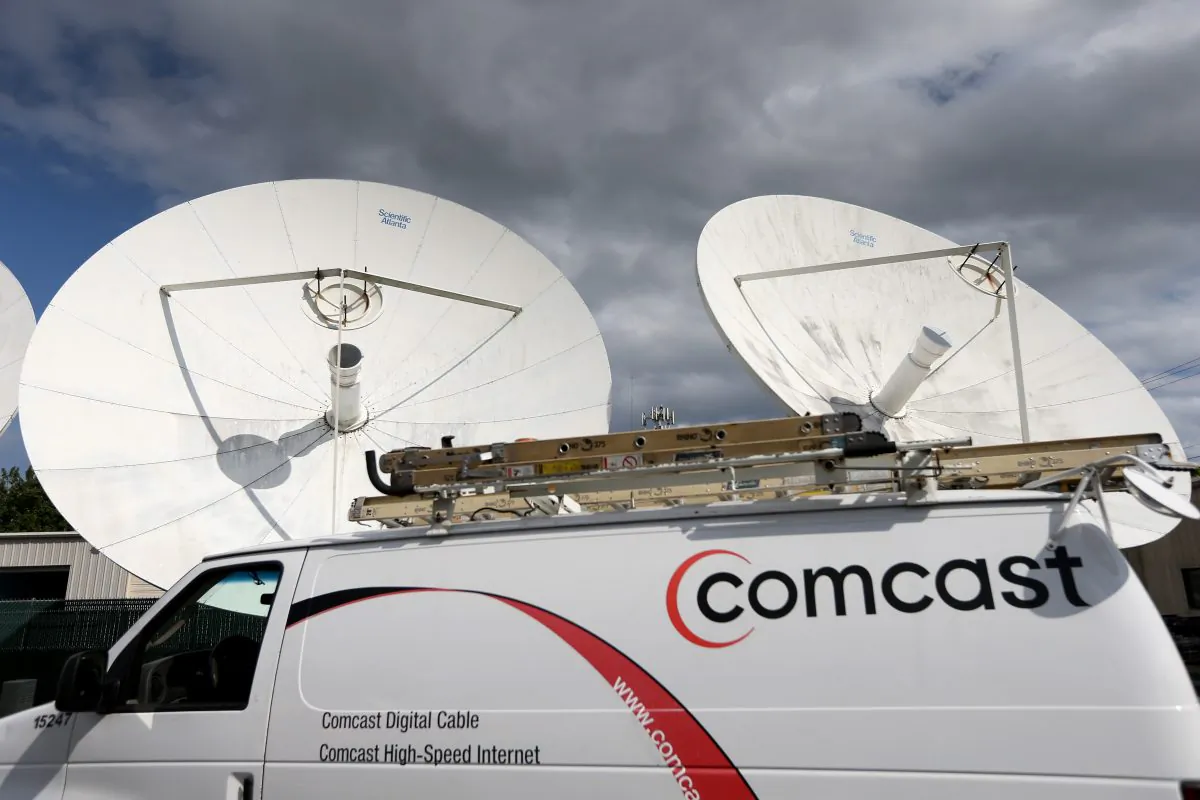 A Comcast truck is seen parked at one of their centers on February 13, 2014 in Pompano Beach, Florida. (Photo by Joe Raedle/Getty Images)