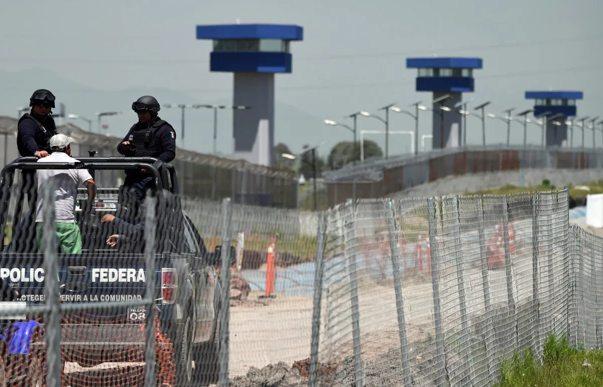 Federal Police officers patrol the perimeter of the Altiplano prison in Almoloya de Juarez, Mexico, on July 13, 2015 a day after the government informed of the escape of drug kingpin Joaquin "El Chapo" Guzman from the maximum-security prison. (Alfredo Estrella/AFP/Getty Images)