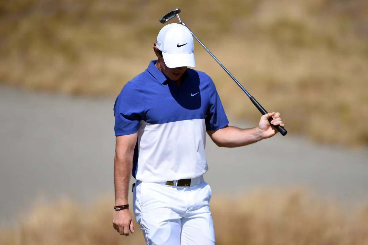 Rory McIlroy will not be defending his British Open championship after suffering a ruptured ligament in his ankle while playing soccer. (Ross Kinnaird/Getty Images) 