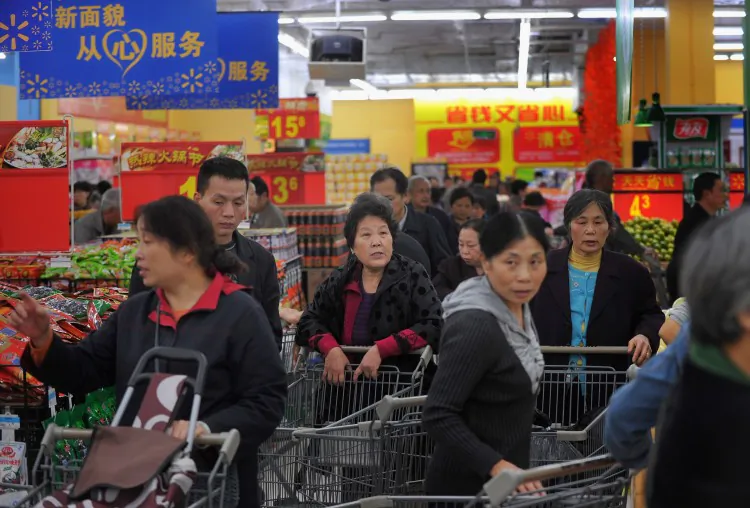 People purchase goods at a Walmart supermarket on October 25, 2011 in Chongqing, China. (ChinaFotoPress/Getty Images)