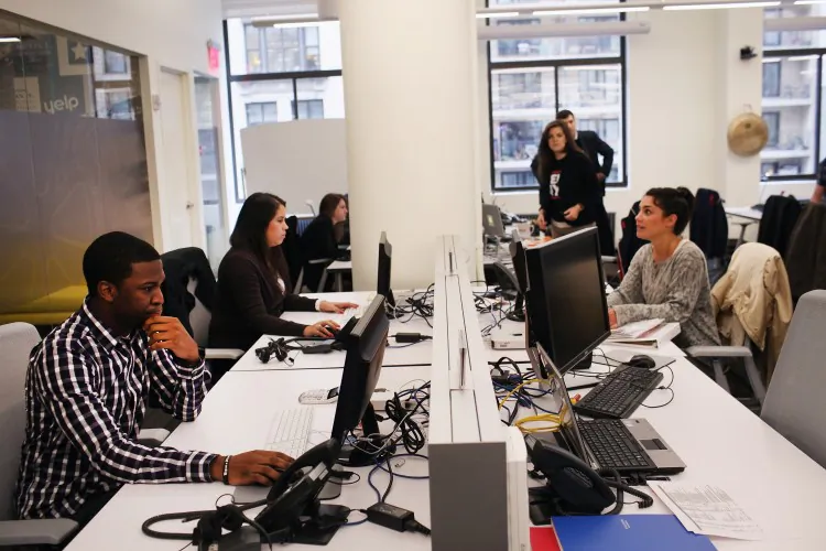 Employees work together in an office in New York, in an undated photo. (Spencer Platt/Getty Images)