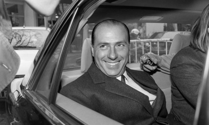 Ex-Prime Minister Silvio Berlusconi, who was former Italian television manager, leaves the Pavillon Gabriel in Paris, on Nov. 22, 1985 after a press conference, after he presented the upcoming privately owned 5th TV channel for which he just signed an agreement with the French government. (Michel Clement/AFP/Getty Images)