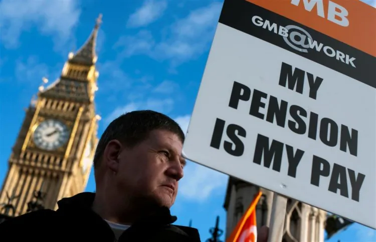 A member of the general trade union GMB stands outside The Houses of Parliament in London on Nov. 30 ADRIAN DENNIS/AFP/Getty Images