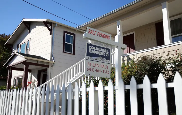A 'sale pending' sign is posted in front of a home for sale in San Rafael, Calif., Nov. 2011. On Thursday, mortgage finance giant Freddie Mac said that the average 30-year mortgage rate rose to 3.92 percent. (Justin Sullivan/Getty Images)