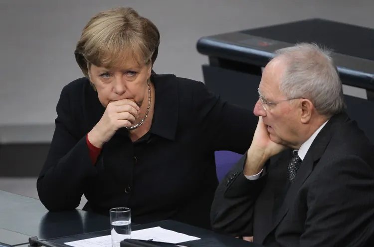 German Chancellor Angela Merkel (L) and Finance Minister Wolfgang Schaeuble attend debates at the Bundestag after she gave a government declaration on the euro and the current eurozone debt crisis on Dec. 2 in Berlin. Merkel is urging changes to financial regulations within the eurozone and said recovery from the current crisis is a long-term process. (Sean Gallup/Getty Images)