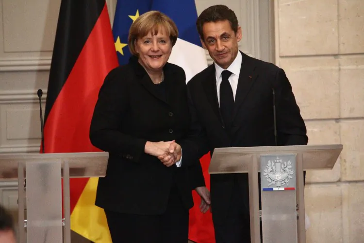 French President Nicolas Sarkozy and German Chancellor Angela Merkel attend a joint press conference for the launch of eurozone crisis talks at Elysee Palace on Dec. 5 in Paris, France. Julien M. Hekimian/Getty Images
