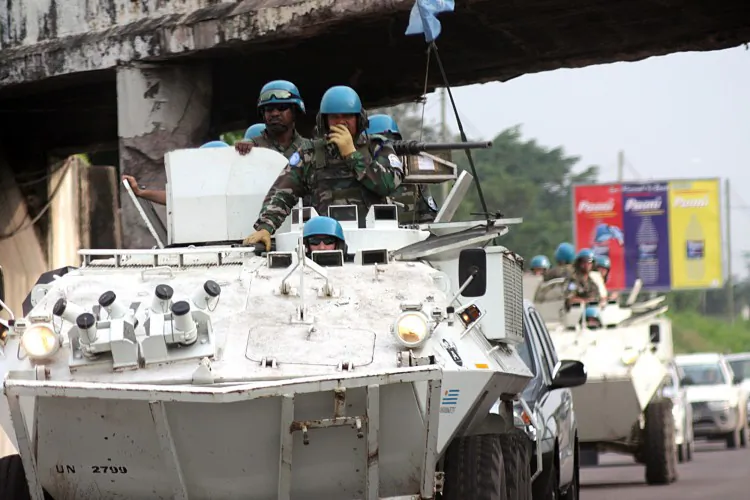 Soldiers from the United Nations Mission in the Democratic Republic of the Congo patrol the streets of Kinshasa on Dec. 6 as the country awaits the results of last week’s presidential elections. (Junior D. Kannah/AFP/Getty)