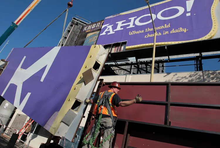 A worker moves a section of a Yahoo billboard onto a truck on Dec. 21, 2011. Yahoo's iconic retro-style billboard was taken down after 12 years of greeting visitors next to Interstate 80 near downtown San Francisco. The struggling Internet company, in need of a turnaround, has hired a new CEO, Scott Thompson, former president of PayPal. (Justin Sullivan/Getty Images)