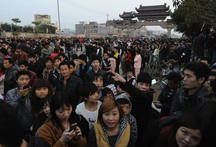 Police block villagers after a large crowd formed at the scene of the environmental protests of the past few days in the town of Haimen, Guangdong Province on December 22. (Mark Ralston/AFP/Getty Images)