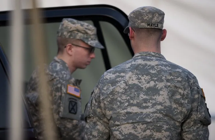 Army Private First Class Bradley Manning (L), surrounded by U.S. military, arrives at a U.S. military Magistrate Court facility during an Article 32 hearing at Fort Meade, Maryland on December 19, 2011. (Jim Watson/AFP/Getty Images)