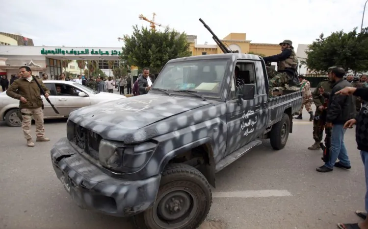 Libyan gunmen gather along Zawiyah Street in the Libyan capital Tripoli on January 3, 2012. (Mahmud Turkia/AFP/Getty Images)