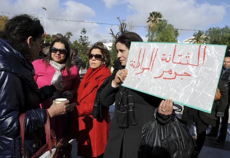 Tunisian artists hold a sign reading 'the essential of citizenship is culture' as they demonstrate for their 'cultural rights' in front of Constituent Assembly on January 8, 2012 in Tunis. (Fethi Belaid/AFP/Getty Images)