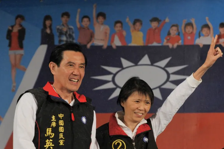 Taiwan President of the ruling Kuomintang Party Ma Ying-jeou and his wife Chou Mei-ching smile as they step on stage after voting results showed that he won the election at his campaign headquarters in Taipei on Jan. 14, 2012. (Aaron Tam/AFP/Getty Images)