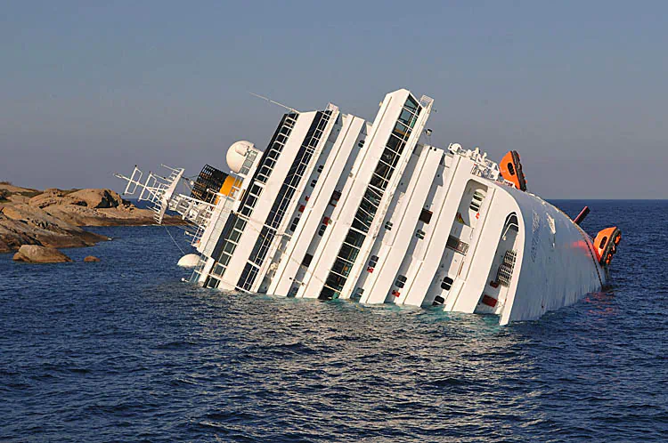 The cruise ship Costa Concordia lies stricken off the shore of the island of Giglio, on January 14, 2012 in Giglio Porto, Italy. More than four thousand people were on board when the ship hit a sandbank. At least 3 people have been confirmed dead and another 70 are unaccounted for. (Laura Lezza/Getty Images)
