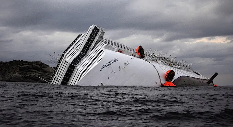 The Costa Concordia cruise ship lies on its side on off the coast of the Tuscan island of Giglio, Italy on Jan. 15, after it ran aground two days earlier. (Filippo Monteforte/AFP/Getty Images)