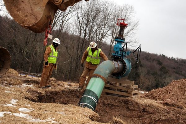 Men with Cabot Oil and Gas work on a natural gas valve at a hydraulic fracturing site on Jan. 18 in South Montrose, Pa. (Spencer Platt/Getty Images)