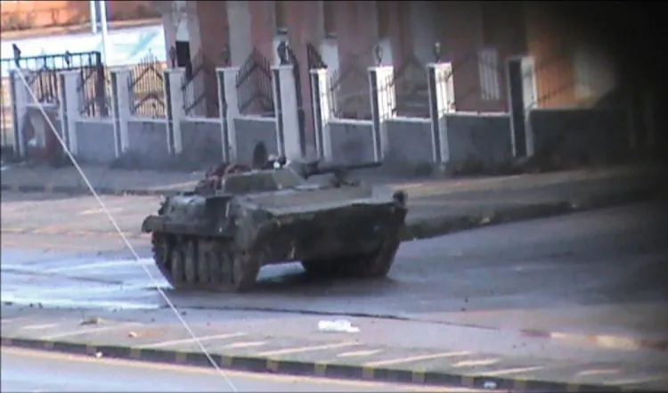 An image grab taken from footage filmed in Homs on January 18, 2012 and received by Agence France Presse (AFP) on January 19, shows a Syrian army tank deployed in the Bayada district of the flashpoint central Syrian city. (STR/AFP)